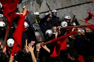 Protesters clash with riot police during a demonstration against planned government reforms in Athens